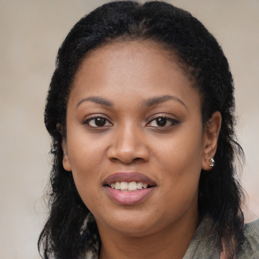 Joyful black young-adult female with medium  black hair and brown eyes