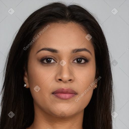 Joyful latino young-adult female with long  brown hair and brown eyes