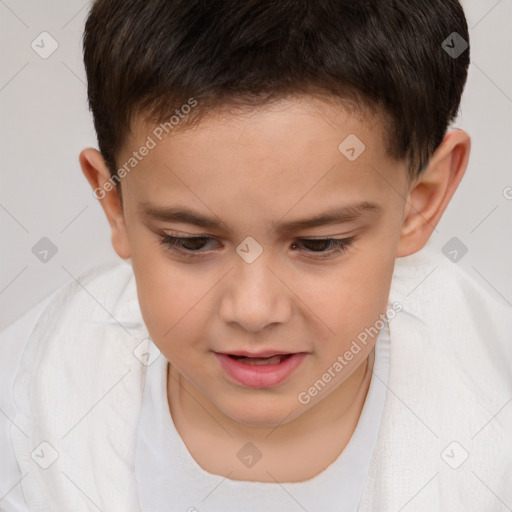 Joyful white child male with short  brown hair and brown eyes