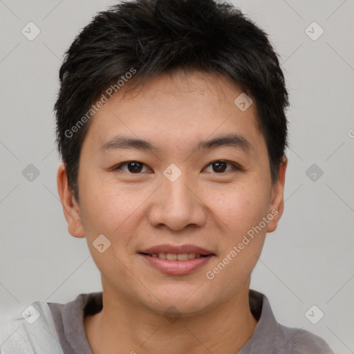 Joyful asian young-adult male with short  brown hair and brown eyes