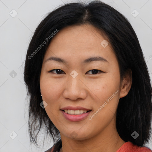 Joyful asian young-adult female with medium  black hair and brown eyes