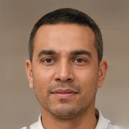 Neutral white young-adult male with short  black hair and brown eyes