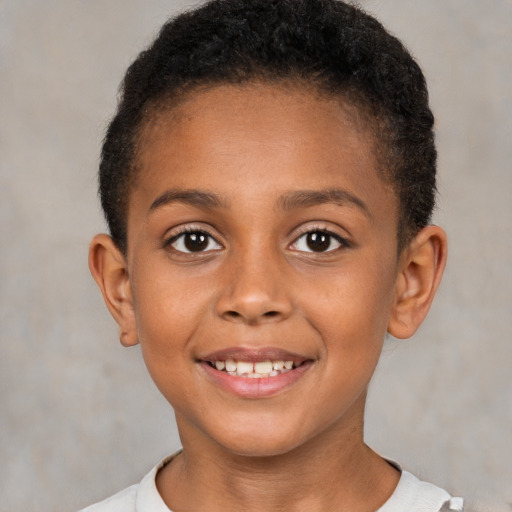 Joyful black child female with short  brown hair and brown eyes