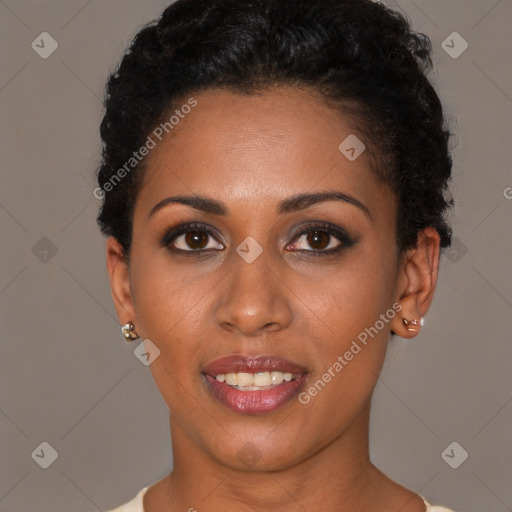 Joyful latino young-adult female with short  black hair and brown eyes