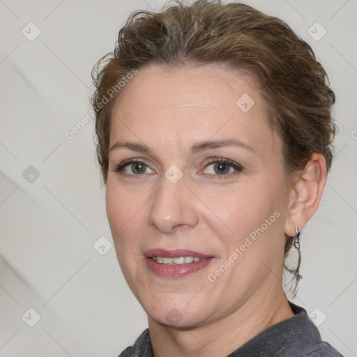 Joyful white adult female with short  brown hair and brown eyes