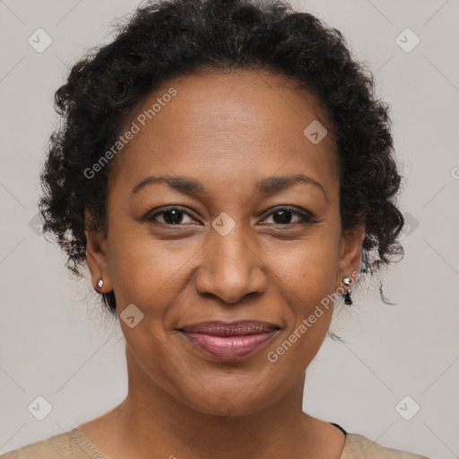 Joyful black adult female with short  brown hair and brown eyes