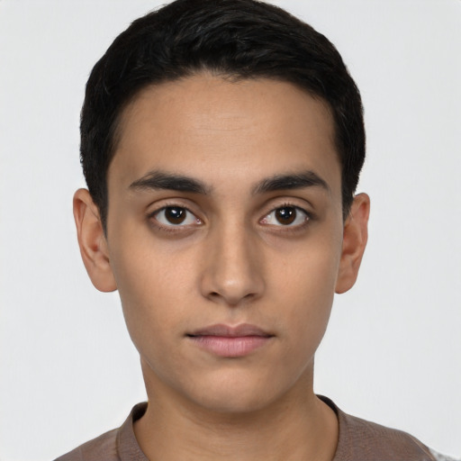 Neutral latino young-adult male with short  brown hair and brown eyes
