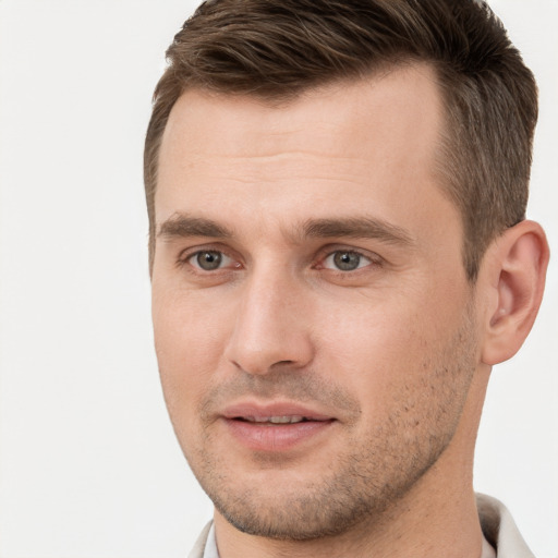 Joyful white young-adult male with short  brown hair and brown eyes