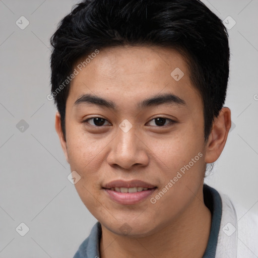 Joyful asian young-adult male with short  black hair and brown eyes