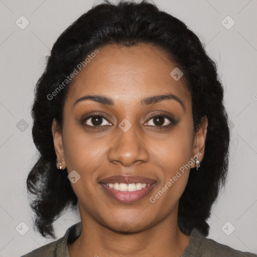 Joyful black young-adult female with long  black hair and brown eyes