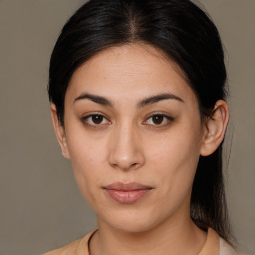 Joyful latino young-adult female with medium  brown hair and brown eyes