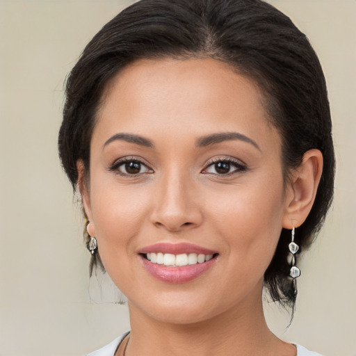 Joyful white young-adult female with medium  brown hair and brown eyes