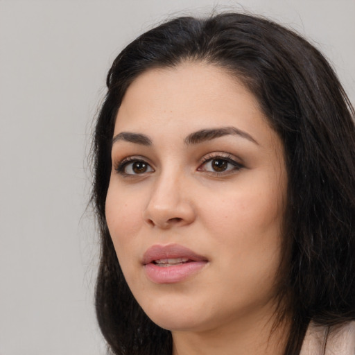 Joyful white young-adult female with long  black hair and brown eyes