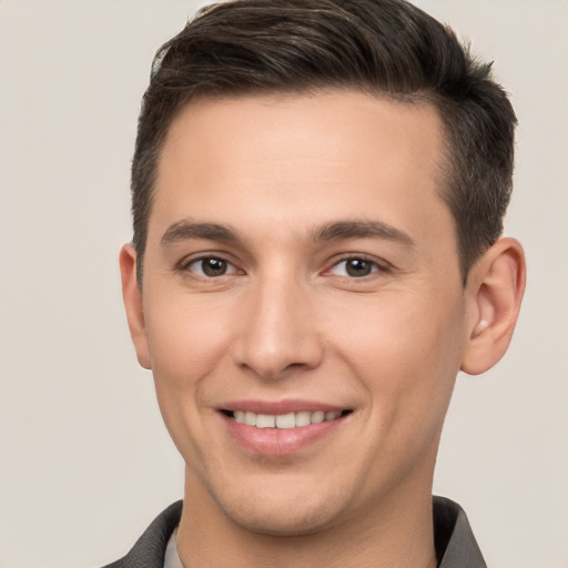 Joyful white young-adult male with short  brown hair and brown eyes