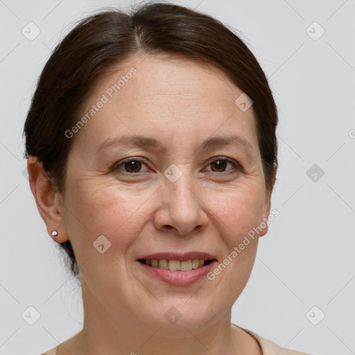 Joyful white adult female with short  brown hair and grey eyes