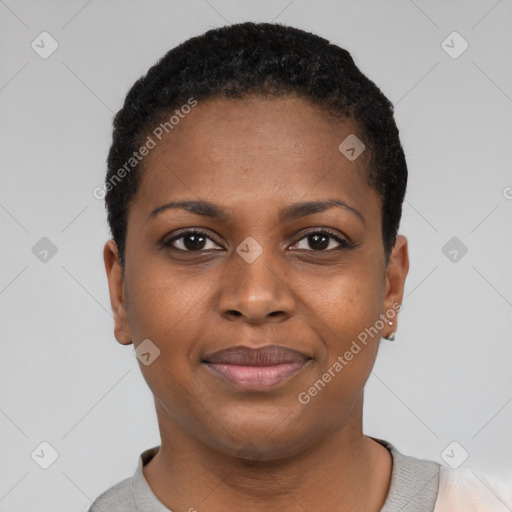 Joyful black young-adult female with short  black hair and brown eyes