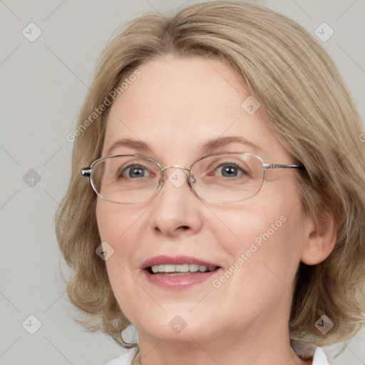 Joyful white adult female with medium  brown hair and blue eyes