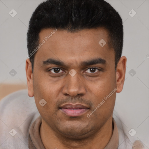 Joyful latino young-adult male with short  black hair and brown eyes