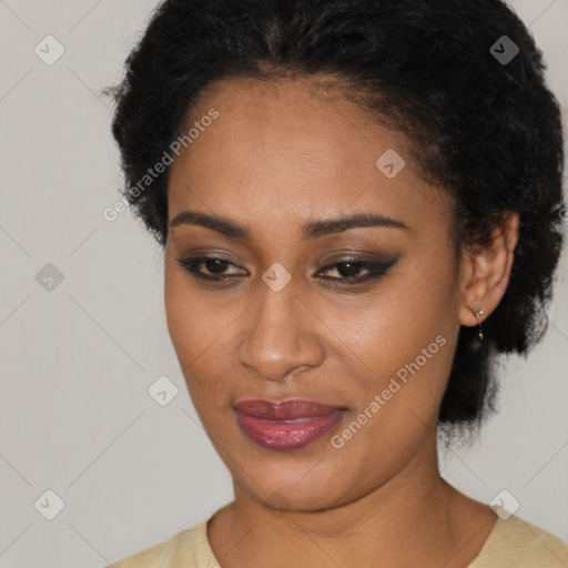 Joyful black young-adult female with short  brown hair and brown eyes