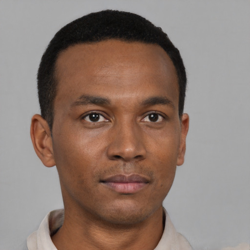 Neutral black young-adult male with short  black hair and brown eyes
