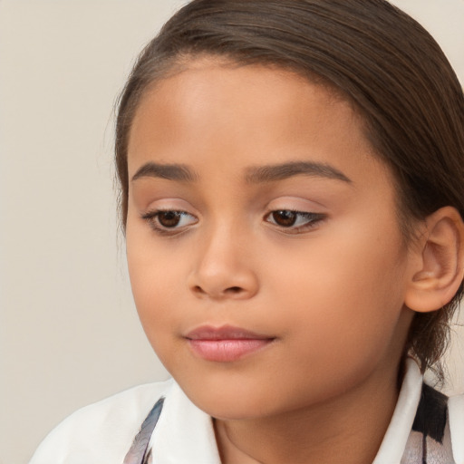 Joyful white child female with medium  brown hair and brown eyes