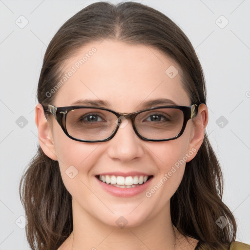 Joyful white young-adult female with long  brown hair and blue eyes