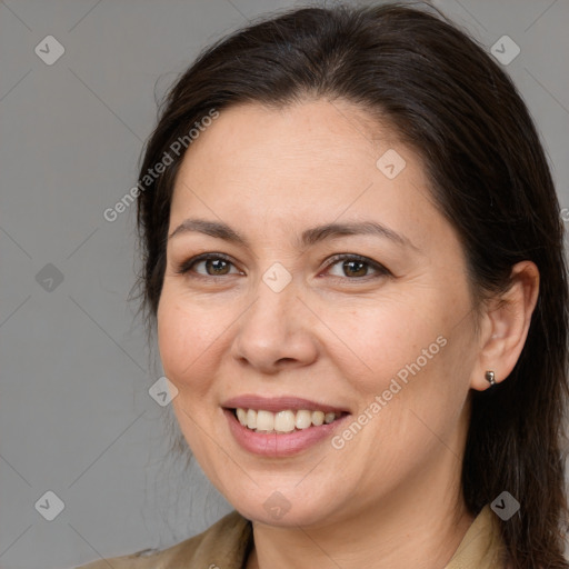 Joyful white adult female with medium  brown hair and brown eyes