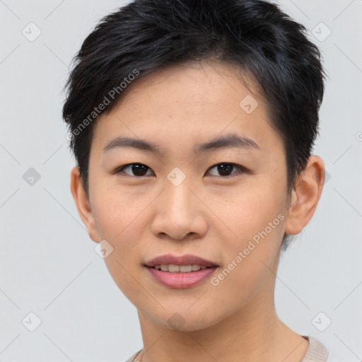 Joyful asian young-adult female with short  brown hair and brown eyes