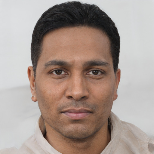 Neutral latino young-adult male with short  black hair and brown eyes