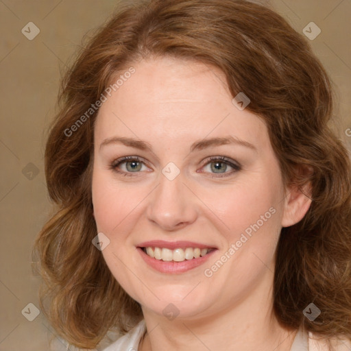 Joyful white young-adult female with medium  brown hair and green eyes