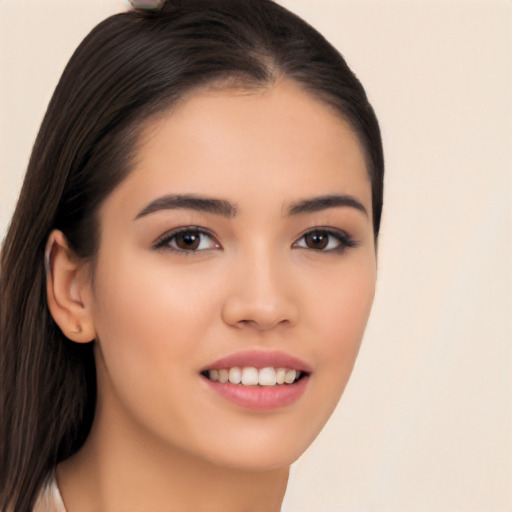 Joyful asian young-adult female with long  brown hair and brown eyes