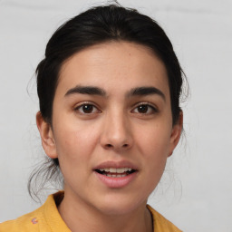 Joyful white young-adult female with medium  brown hair and brown eyes