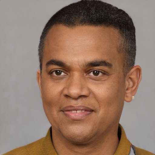 Joyful latino adult male with short  black hair and brown eyes