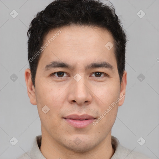 Joyful latino young-adult male with short  brown hair and brown eyes