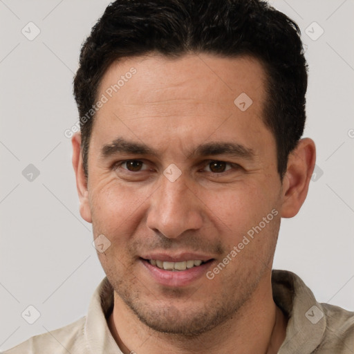 Joyful white adult male with short  brown hair and brown eyes