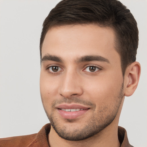 Joyful white young-adult male with short  brown hair and brown eyes