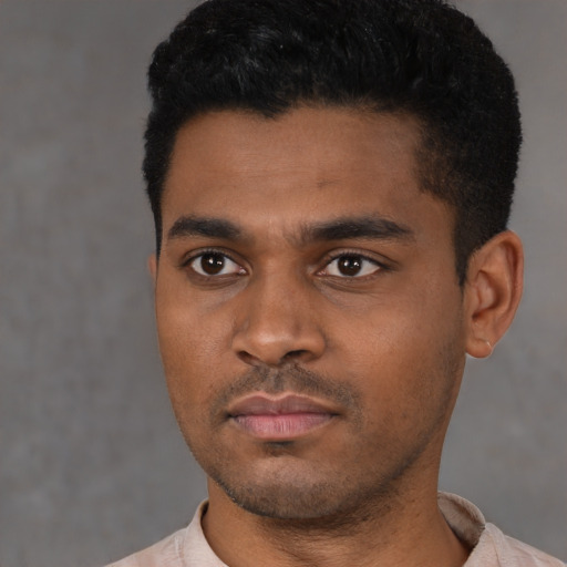 Neutral latino young-adult male with short  black hair and brown eyes