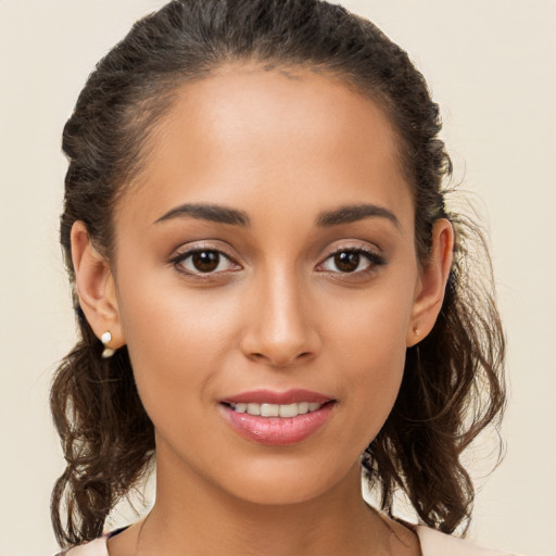 Joyful white young-adult female with long  brown hair and brown eyes