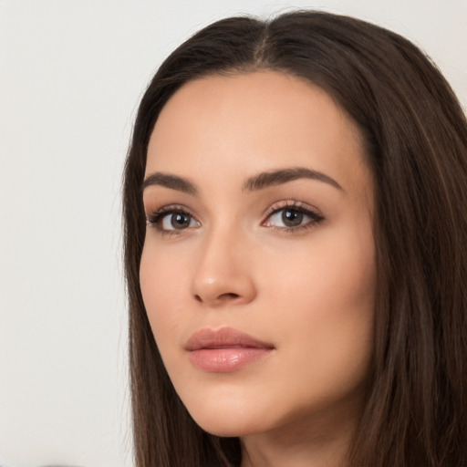 Neutral white young-adult female with long  brown hair and brown eyes