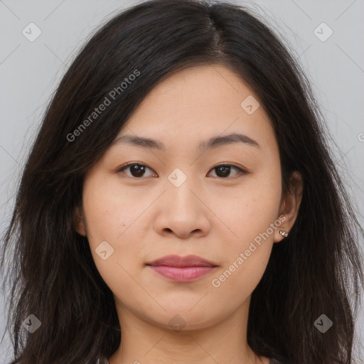 Joyful asian young-adult female with long  brown hair and brown eyes