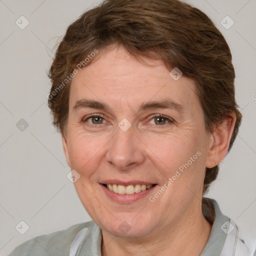 Joyful white adult female with short  brown hair and brown eyes