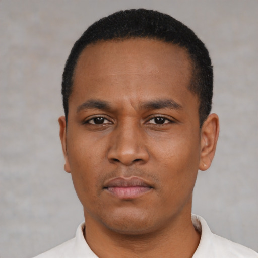 Neutral black young-adult male with short  black hair and brown eyes