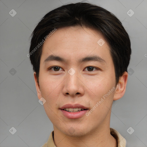 Joyful asian young-adult male with short  brown hair and brown eyes