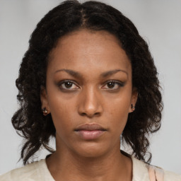 Neutral black young-adult female with long  brown hair and brown eyes