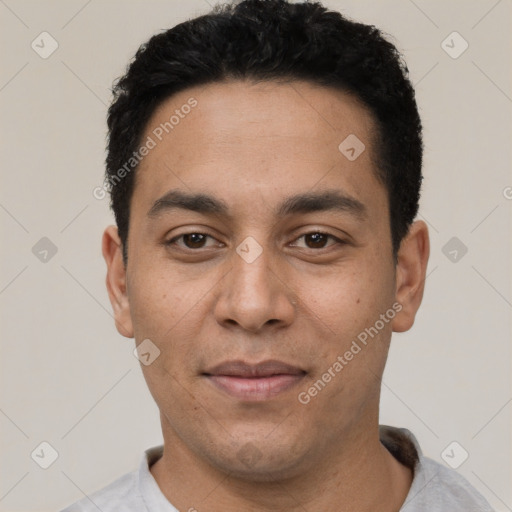 Joyful white young-adult male with short  black hair and brown eyes