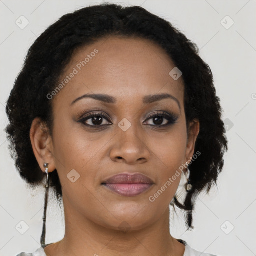 Joyful black young-adult female with short  brown hair and brown eyes
