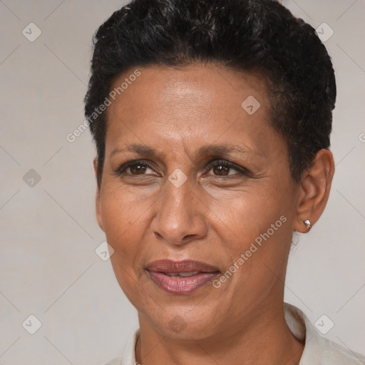 Joyful black adult female with short  brown hair and brown eyes