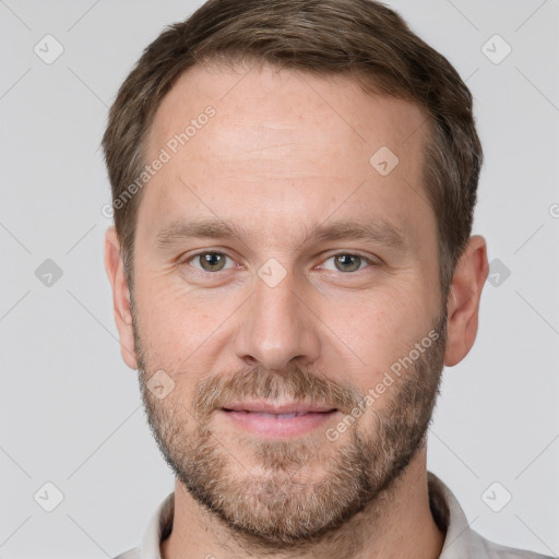 Joyful white adult male with short  brown hair and grey eyes