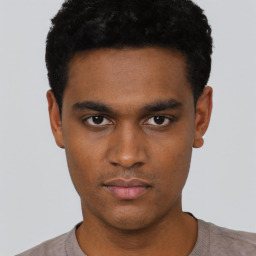 Neutral black young-adult male with short  black hair and brown eyes