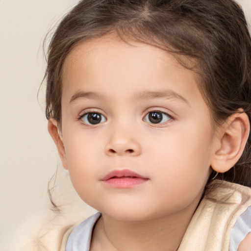 Neutral white child female with medium  brown hair and brown eyes